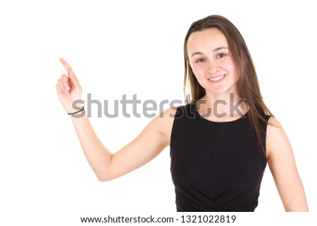 Beautiful smiling young woman in casual wear pointing with finger looking at camera