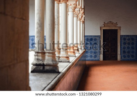 Ancient monastery cloister in portugal with the traditional painted tiles (azulejos) decorating the walls