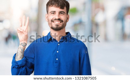 Young handsome man over isolated background showing and pointing up with fingers number three while smiling confident and happy.