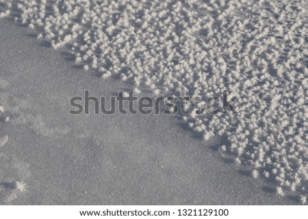 Different shape of snow on lake