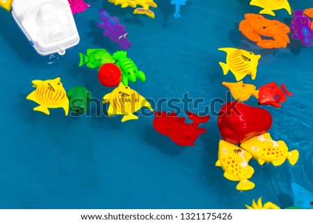 toys related to water and sea in small pool 