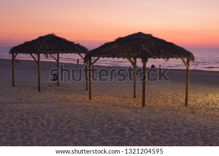 beach wooden tent sunset