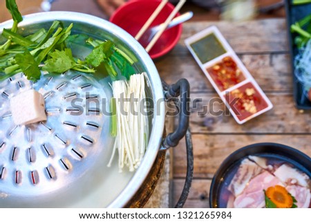 Thai barbecue pork (Moo-Ka-Ta)  - famous Thai local food with need to do own cooking - food photography concept