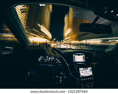 This shot from the interior of a car, depicting fast motion during the night.