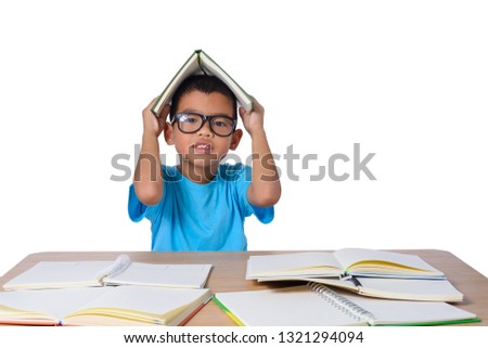 little girl with glasses thought and many book on the table. back to school concept, isolated on white background with clipping path