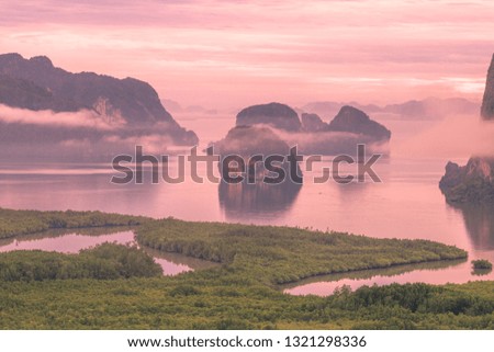 The panoramic background of the surrounding scenery (mountains, sea, islands, clouds, the sky) and the light from the sun in the morning beauty, colorful, is the beauty of nature during travel.