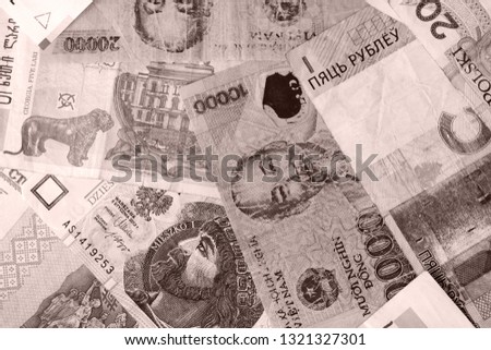 Different countries money background close up. Brown color toned