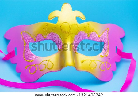 carnival mask with blue background