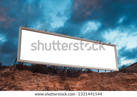 Blank white billboard on hill. Mock up. Poster near roadway. Empty space for text. Isolated white screen. Mockup for advertising banners