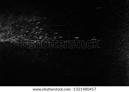 Grainy abstract texture on a black background. Design element