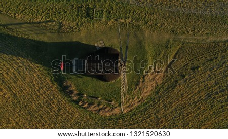 Stunning aerial shot of the windmill on a sunny day in Pitstone England