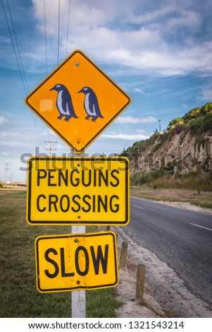 Penguins crossing sign near Blue Penguin colony in Oamaru, New Zealand