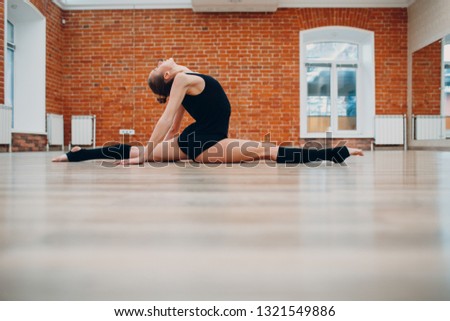 Young woman dancing in a dance studio