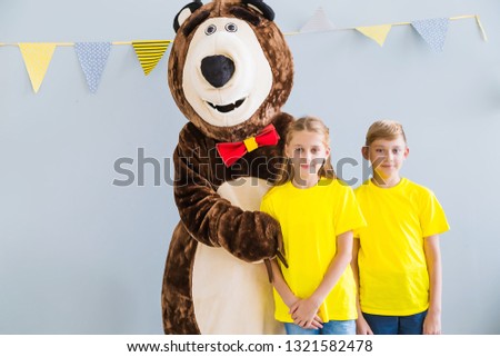 Animator in a bear costume for children's birthday party