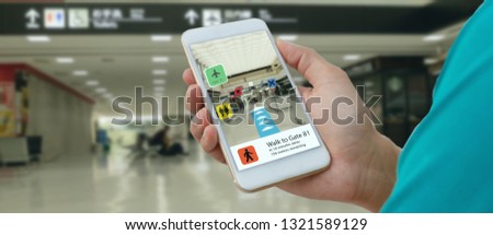 smart technology in industry mobile 4.0 or 5.0 concept , user use mobile phone with augmented mixed virtual reality technology in real 3d for show the map,shop,  and walk way path to gate in airport Royalty-Free Stock Photo #1321589129