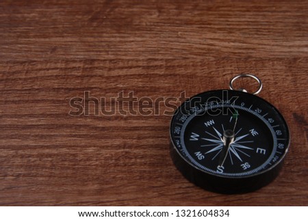 compass isolated on wooden background