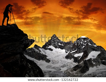 photographer taking a picture the sunset over the Gabelhorn - Swiss Alps