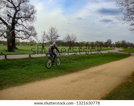 A person riding a bicycle in a park