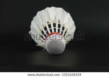 a shuttlecock on a isolated black background