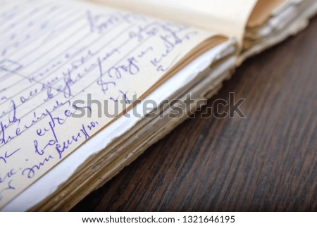 old medical card of the disease. Medical record of the patient. Manuscript on the table. old written paper on the table. Old notebook on the table