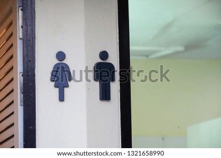 Toilet sign symbol man and woman in hotel.