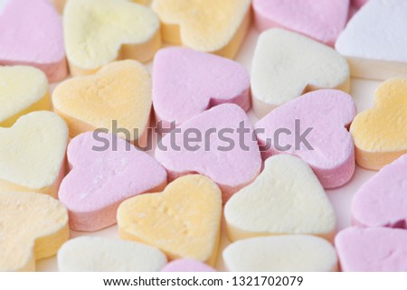 pastel colored candy hearts, macro photo as background picture