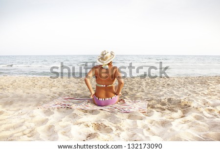 Young fashion woman on the beach