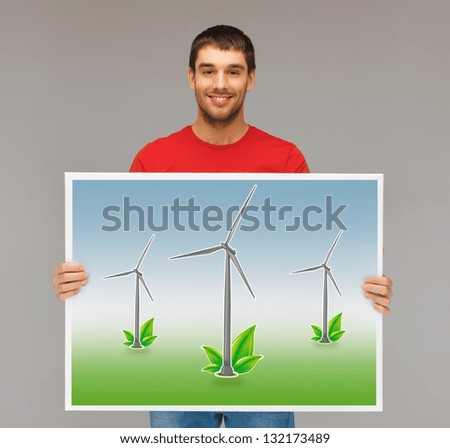handsome man with picture of wind turbines