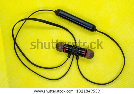 headphones on yellow background
