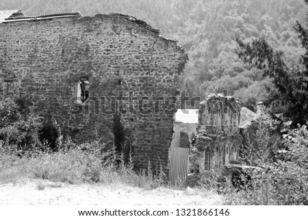 ruined ancient buildings in black and white colour