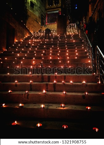 The diyas (oil lamps) are lined up at the ghats of Varanasi during the Dev Diwali Festival. Earthen lamps are lined up beautifully near Ganges river