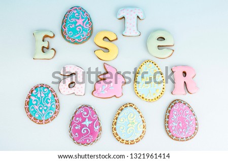Bright Easter background.  Decoration eggs and colorful letters forming words  EASTER. Celebration concept. Studio Photo