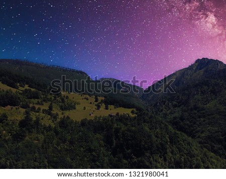 Summer night landscape with mountain under a starry sky 