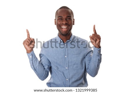 Portrait of smiling african businessman with fingers pointing against isolated white background
