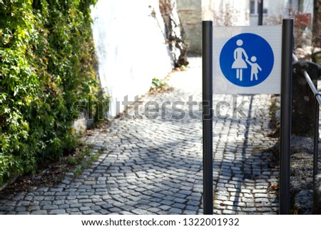 sign for the pedestrian path in the city center