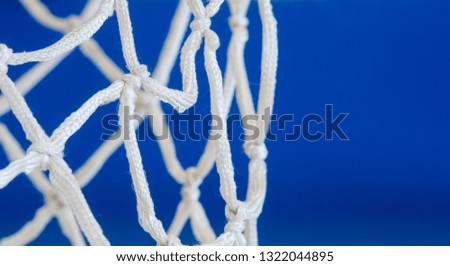 Empty Swooshing Basketball Net Close Up with blue Background