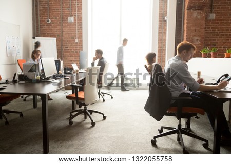 Busy staff employees business women men group working on computers in office rush in modern big coworking room, diverse corporate team people workers using pc at workplace moving in enterprise space Royalty-Free Stock Photo #1322055758