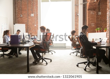 Business team women men workers working on computers in modern big coworking enterprise space, busy staff diverse professional employees office people group sitting at desks using pc at workplace Royalty-Free Stock Photo #1322061905
