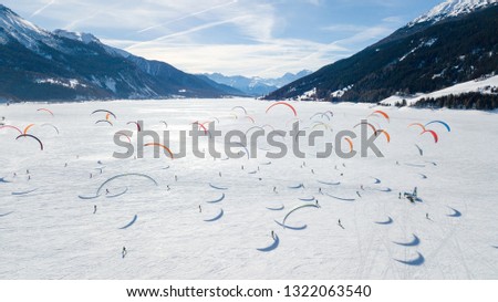 Snowkite race on Lago di Resia Royalty-Free Stock Photo #1322063540
