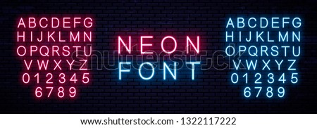 Neon capital Letters and numbers, blue and red. Glowing English font. Vector neon alphabet on wall background. Royalty-Free Stock Photo #1322117222