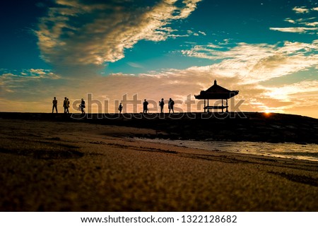 A beautiful morning with a colorful sunrise  at Nusa Dua Beach Bali  Royalty-Free Stock Photo #1322128682