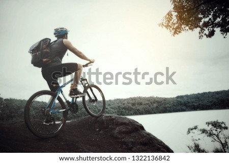 Cyclist On Sunny Day.Bike Adventure Travel Photo