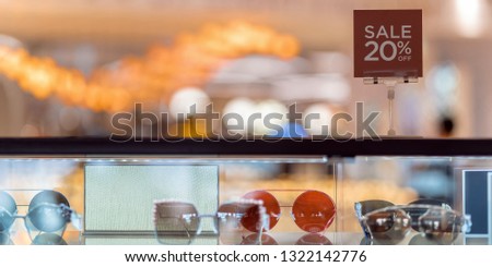 Banner and web page or cover template of Sale 20 off mock up advertise display frame setting over the Glass cabinet in the shopping department store for shopping