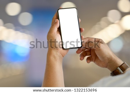Man using smart phone and blurred bokeh background