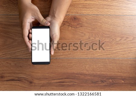 Man hand holding the black smartphone screen mockup
