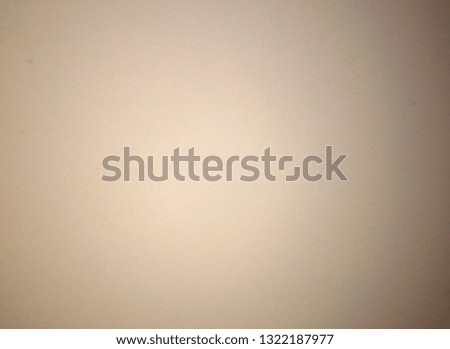 Light brown blurred solid color background. Texture, gradient, vignetting, close-up.
