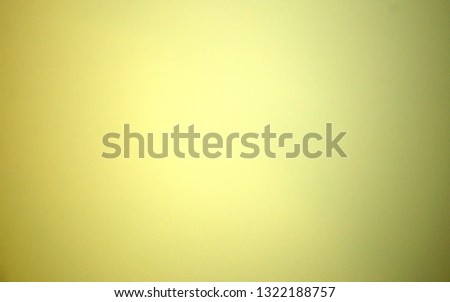 Yellow blurred solid color background. Texture, gradient, vignetting, close-up.
