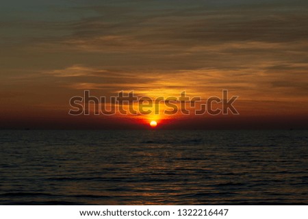 Sunset at the end of the sea
