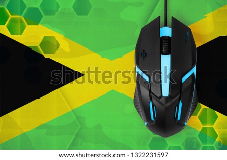 Jamaica flag  and computer mouse. Concept of country representing e-sports team