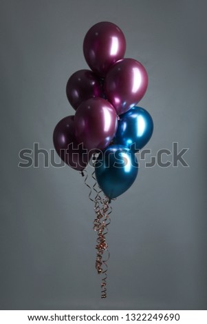 Bunch of color balloons on grey background
